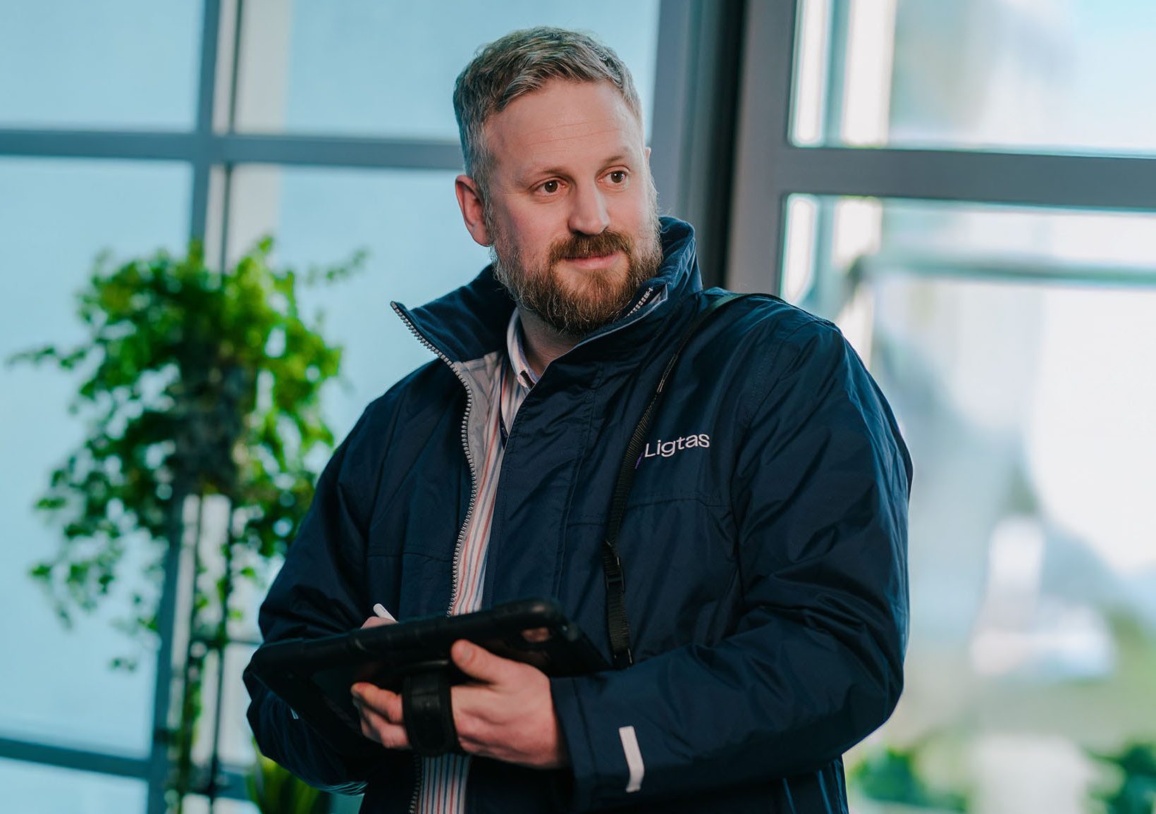 Ligtas fire safety consultant reviewing residential evacuation plans.